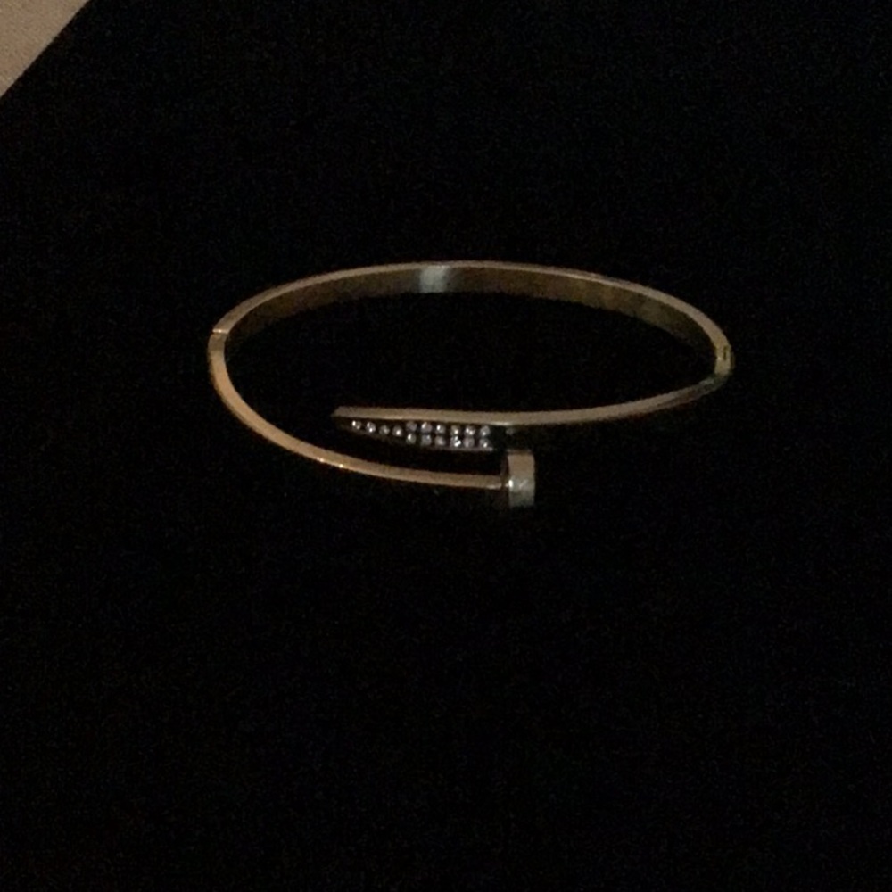 Elegant gold tone Nail Bracelet with Rhinestone Accents. Hinged on one side.EUC